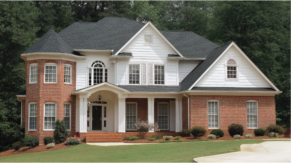 Suburban house with a blend of brick and white siding, gable rooflines, and traditional architectural details surrounded by greenery
